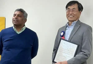 Kundan Kishor, Chair presents resolution to Sunny