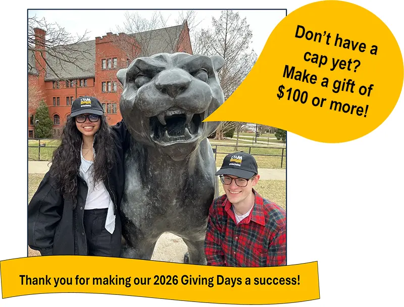two students with the Pounce Mascot statue promoting UWM Giving Days