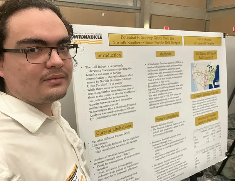 Undergraduate David Gomez with his poster