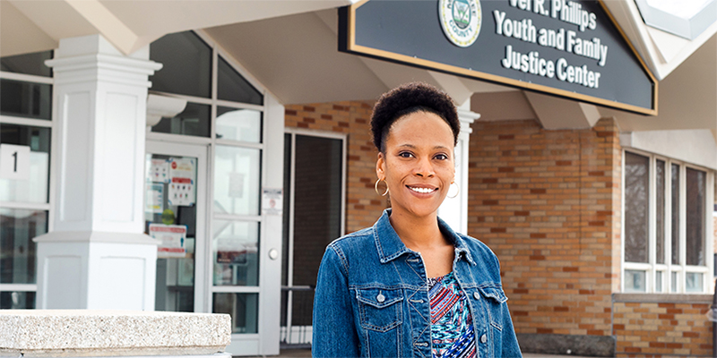 Krishana Robinson (black woman) pictured outside the Vel R. Phillips Juvenile Justice Center School