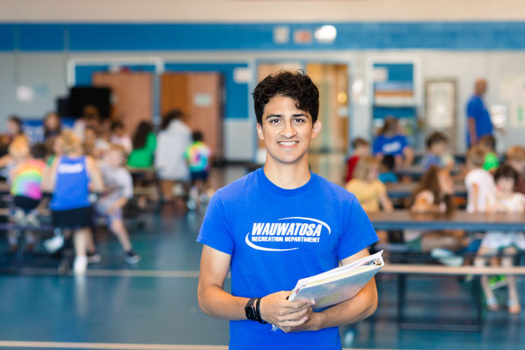 School of Education student teacher Siraj Khan pictured working at his summer job with the Wauwatosa Recreation Department