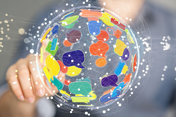 Picture of a clear see through globe with colorful chat bubbles
