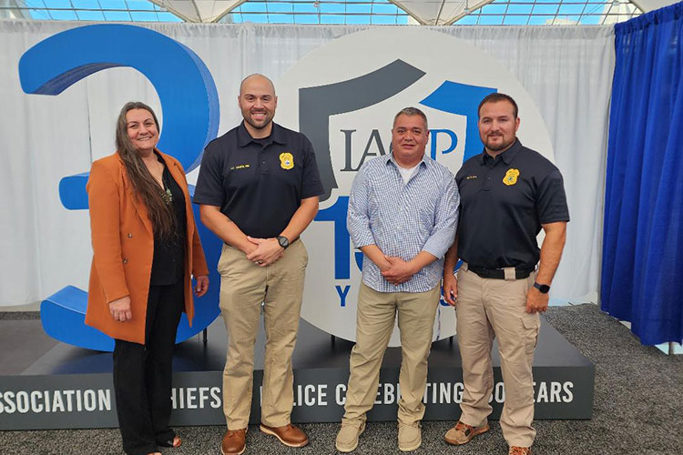 Leah Rouse, Lt. Brandon Vande Hei, Sgt. Nathan Ness, and Chief of Police Eric Boulanger at the International Association of Chiefs of Police Conference, where the group presented on their wellness plan.