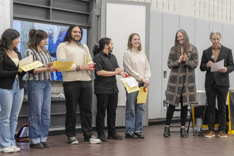 Undergraduate students hearing kind words from success team. 