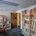 Bookshelves filled with books in the EQI Library