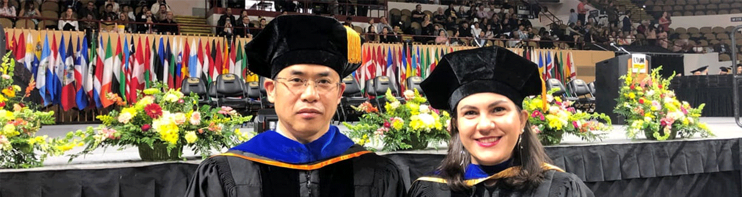 faculty member zeyun Yu and new doctoral graduate