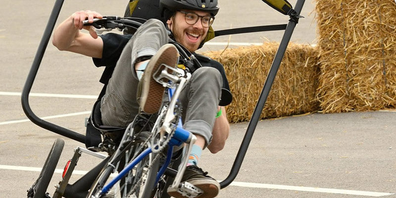 Student riding an engineered bicycle