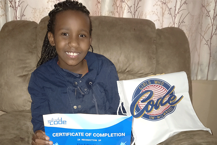 Elsie Maingi shows off Girls Who Code completion document