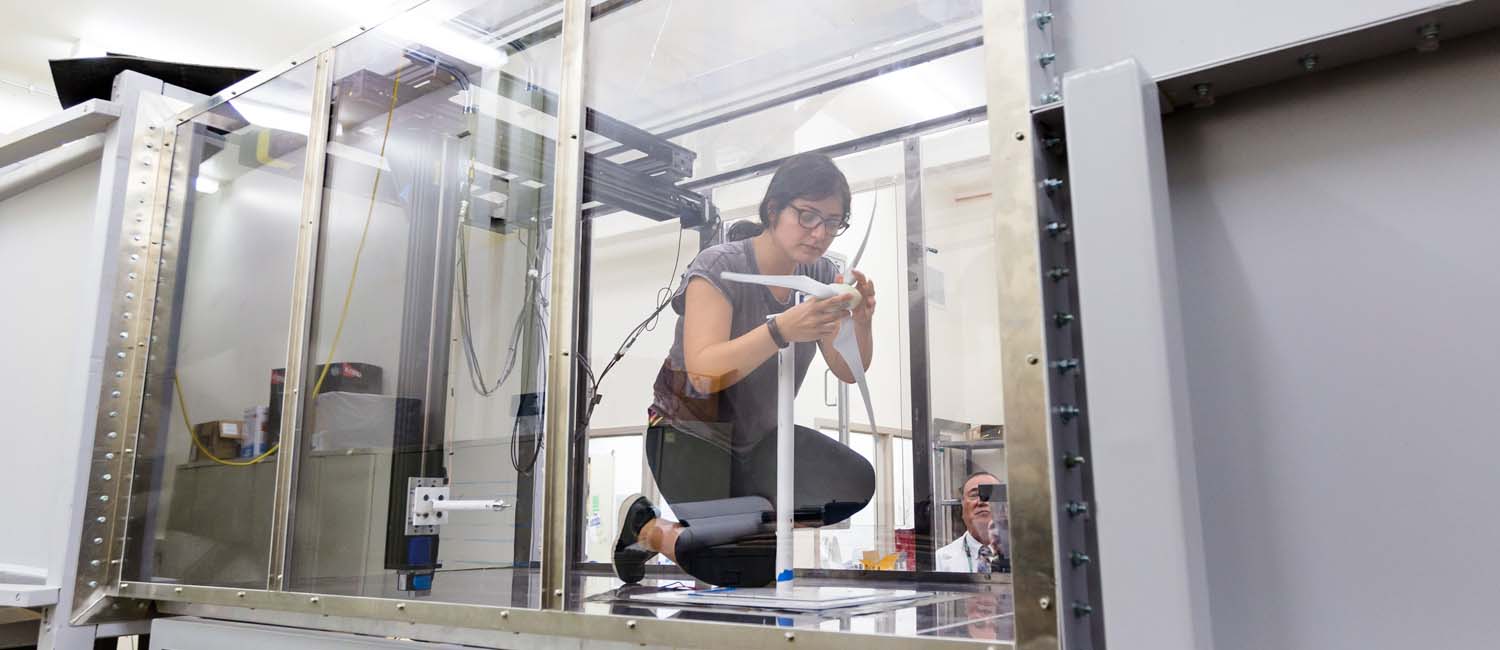 Student researcher working in the wind tunnel