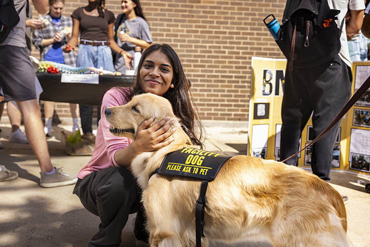 woman petting dog