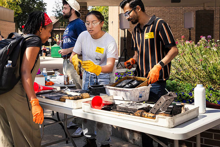 two people demonstrating to a third