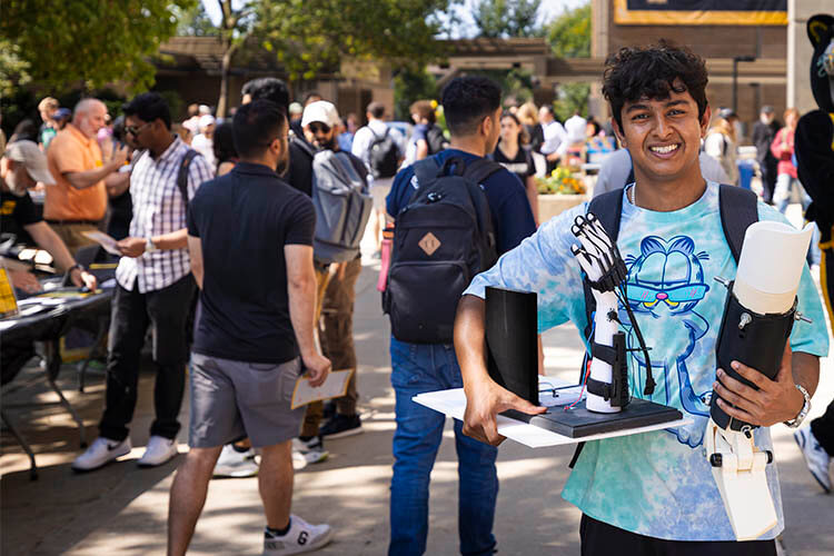 a young man holding equipment