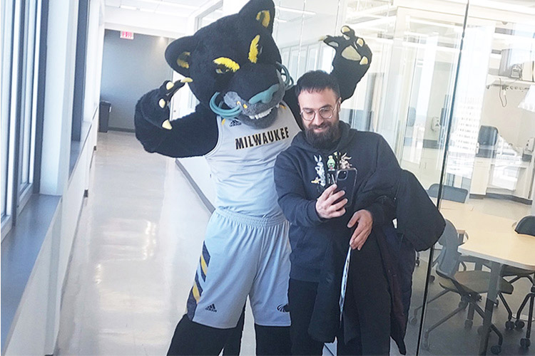 a man and a mascot take a selfie a man and a mascot take a selfie