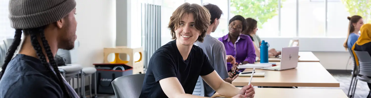 students talking to each other in classroom