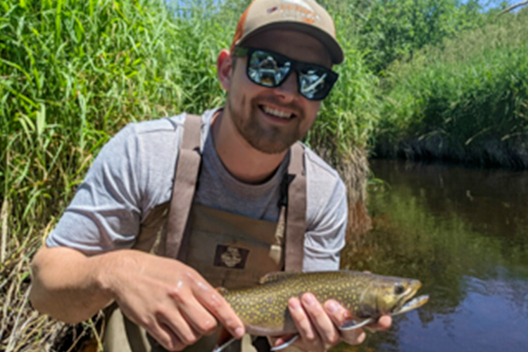 Lee DuBois holding a trout