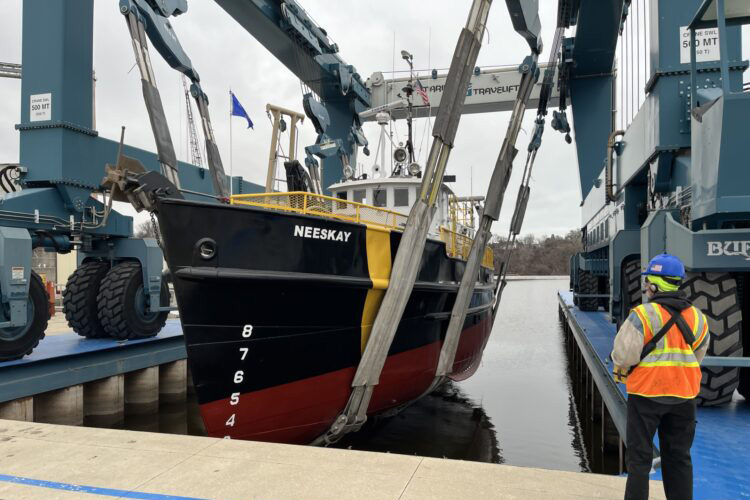 Neeskay being hoisted out of the water for maintenance