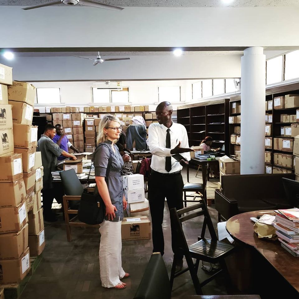 Yakubu Sibdoo Osman, the Head of Human Resources with the Ghana Library Authority in the procurement office looking at the current stock of book donations.