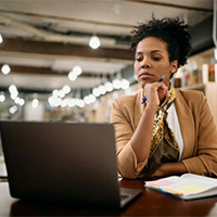Image of woman working on laptop