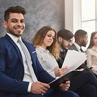 Multiethnic people waiting in queue. preparing for job interview