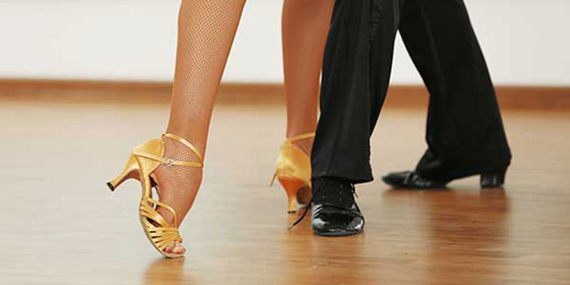 Woman and man legs in active ballroom dance.