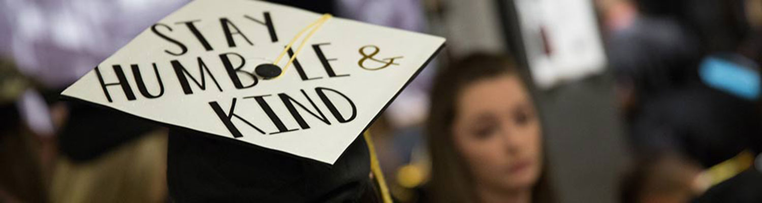 Decorated graduation cap that says, "Stay Humble and Be Kind"