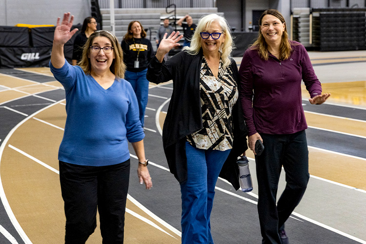 UWM employees walking at the Klotsche Center.