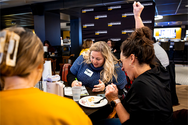 UWM employees playing trivia at the Gasthaus.