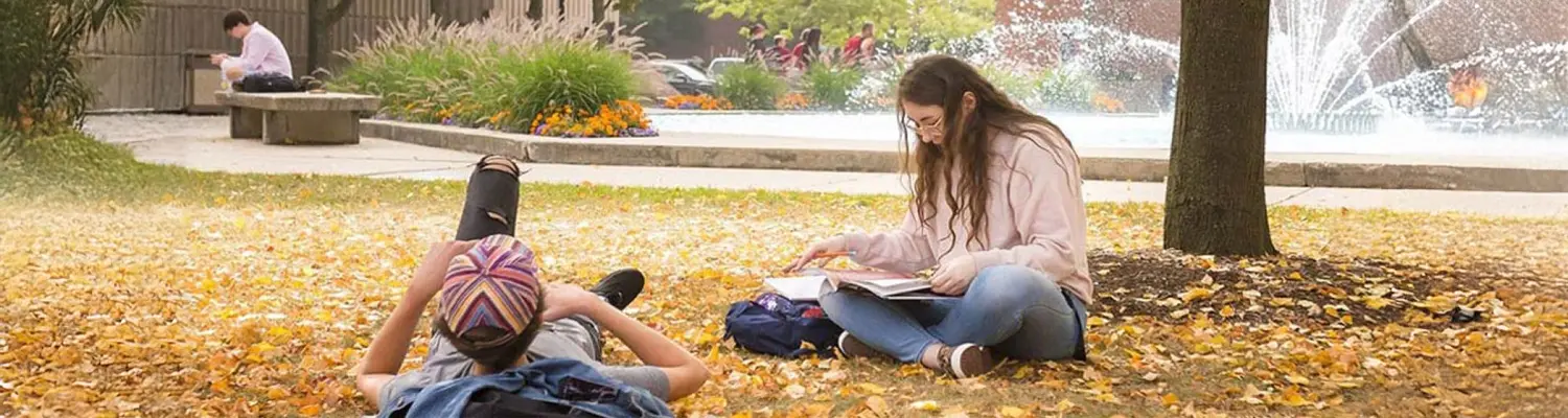 students sitting around campus studying