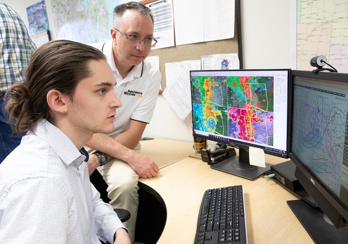 IW student and mentor looking at radar data on a computer