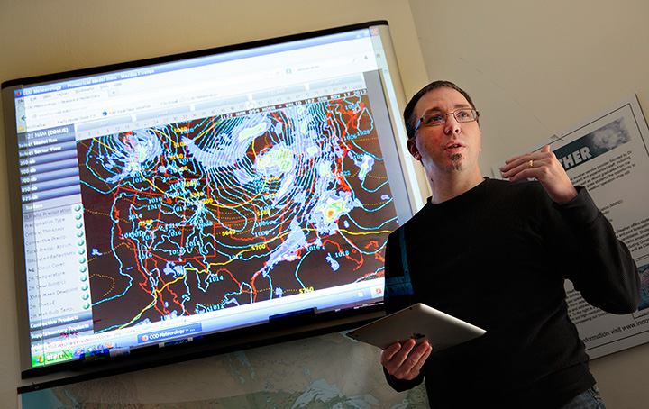 Academic staff presenting weather information