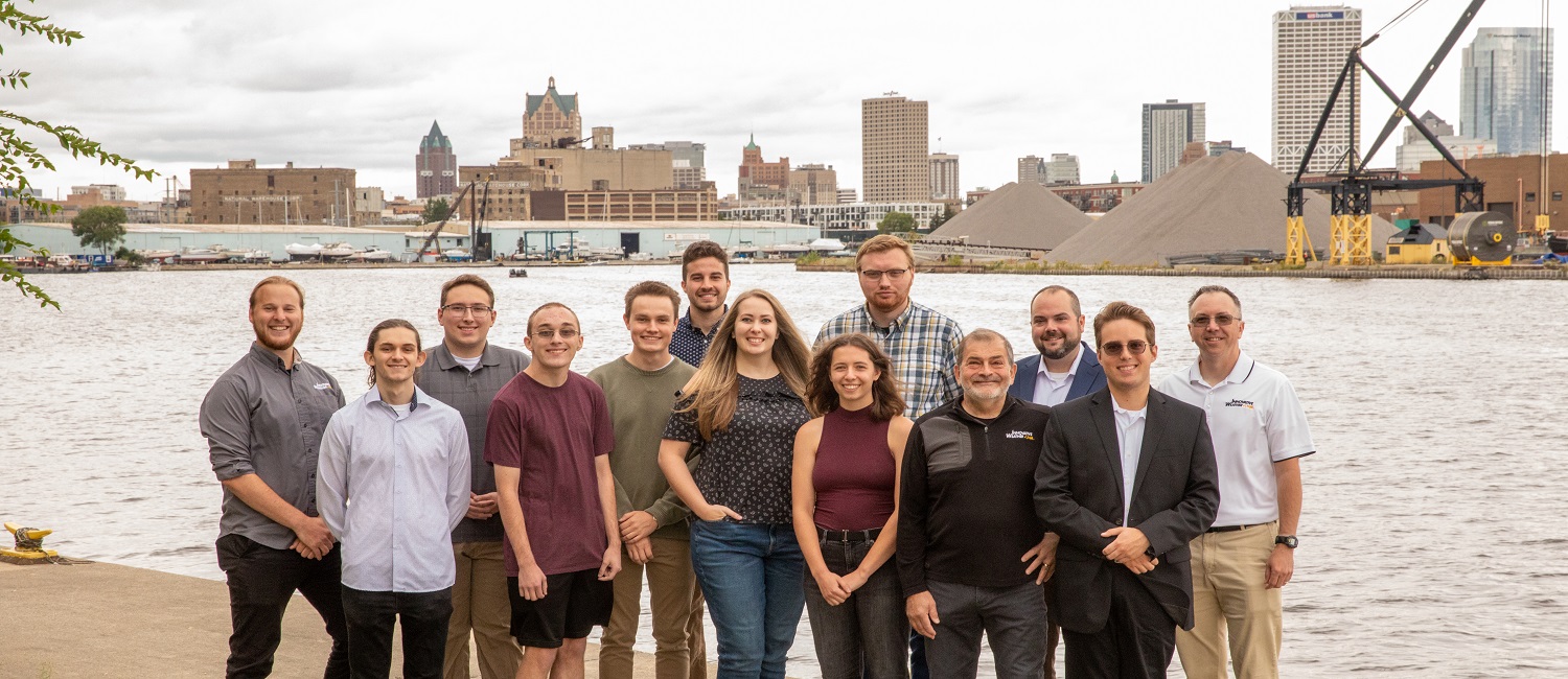 Group photo of IW Staff in front of Milwaukee's Harbor