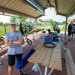 Anne Dressel at Westlawn picnic area with bike repair in back