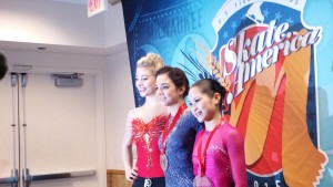 Women's competition medalists at Skate America Milwaukee. On right is Miyahara Satoko, from Japan.