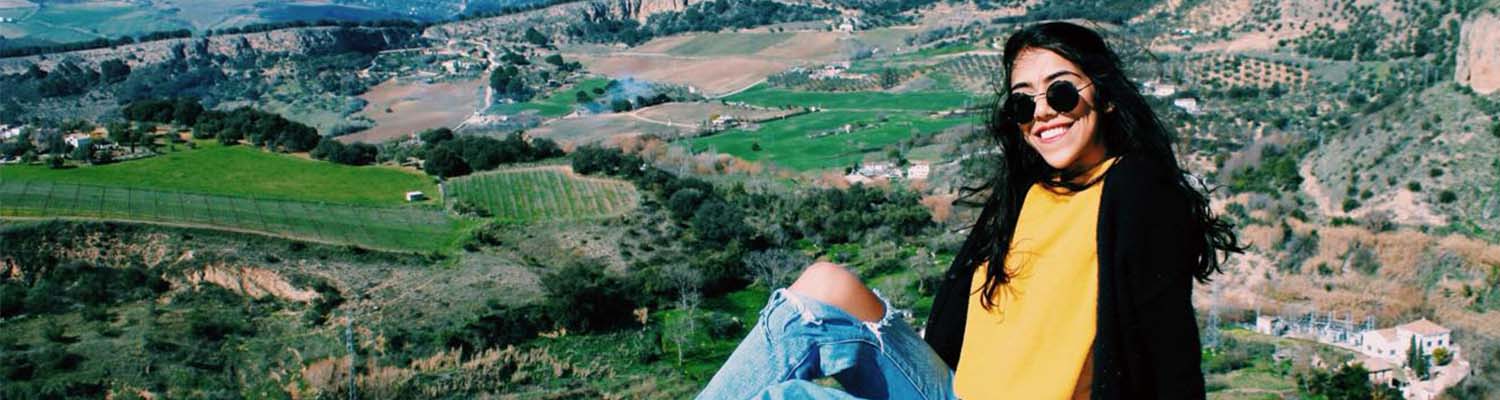 person sitting on hillside
