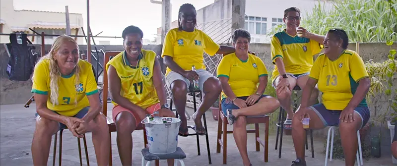 a team of people sitting and drinking beer