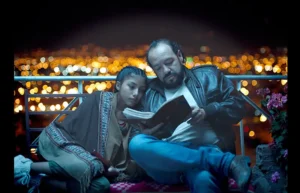 one person reading a book to another