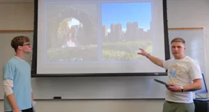 Two young men stand in front of projector screen showing two photos of Chinese landmarks.