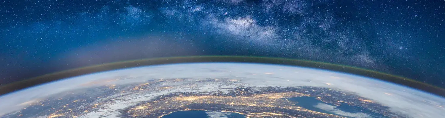 shot of earth from space with Milky Way in background
