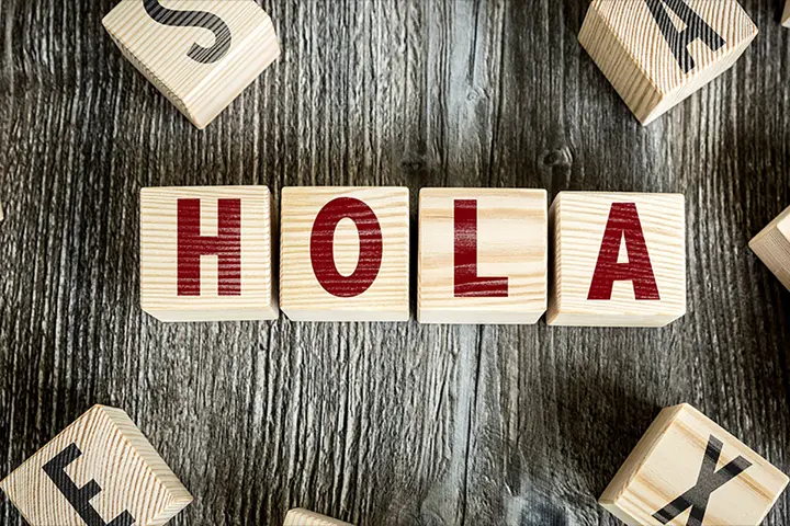 Stock photo of wooden alphabet blocks that spell Hola