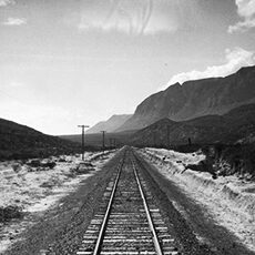 railroad tracks amid mountains