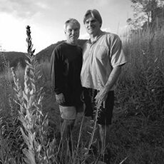 Photograph of two men in a field