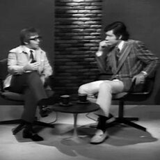 detail of two men speaking from Conversation video collection