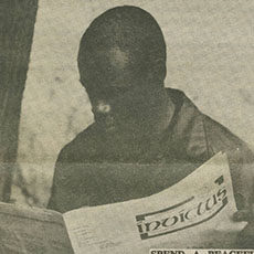 Man reading Invictus newspaper