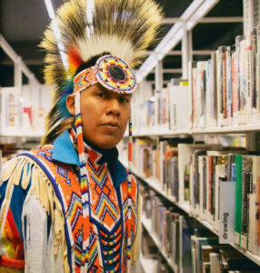 Photo of Native American in a library
