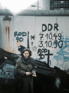 UWM Professor of Sociology Dr. Jennifer Jordan stands in front of a graffitied wall.