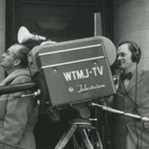 Man operates camera for WTMJ-TV.