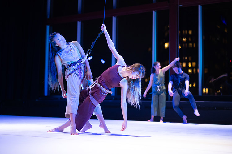 Students performing a dance on stage