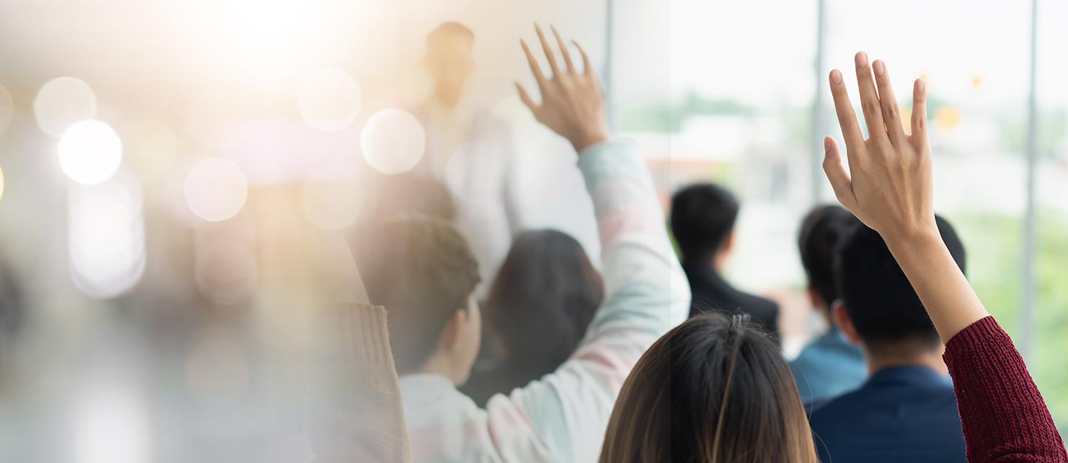 People raising their hands