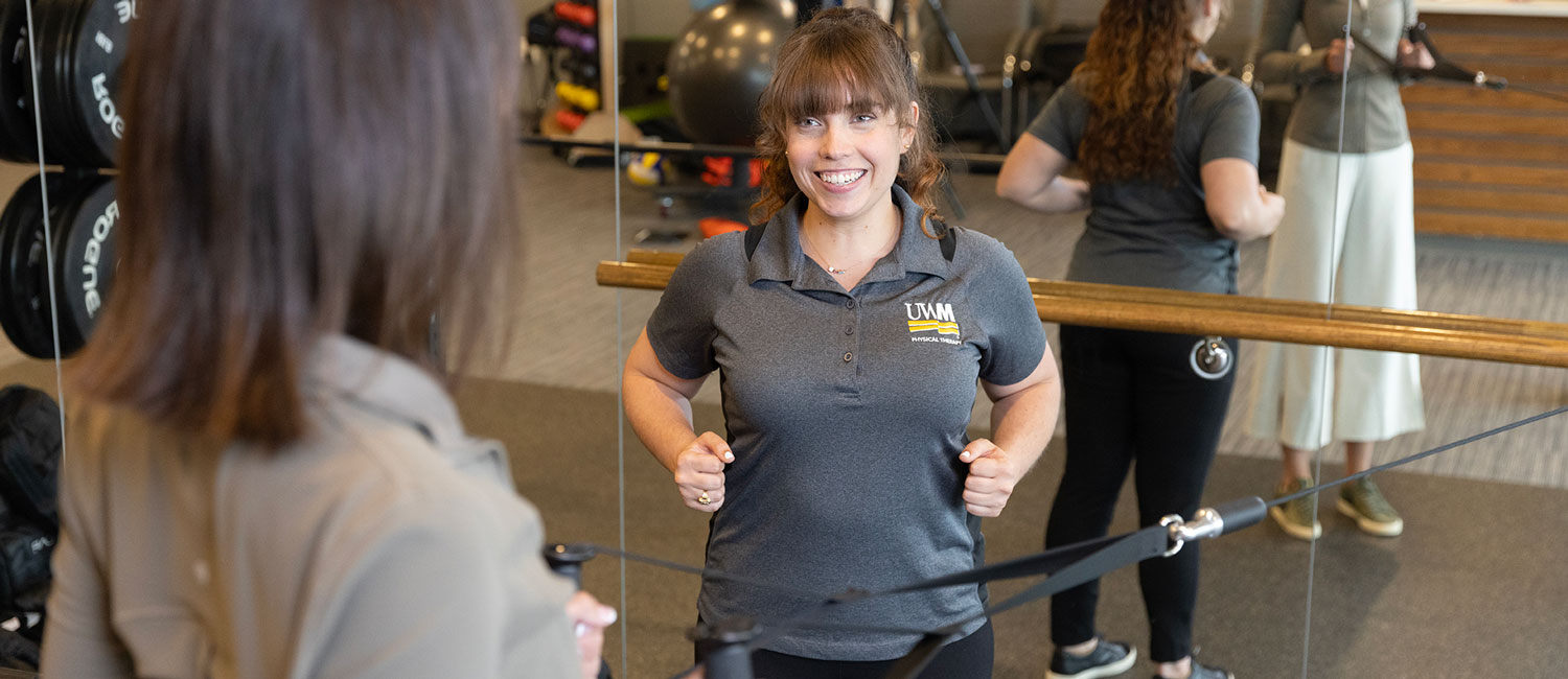 Doctor of physical therapy student works with a client.