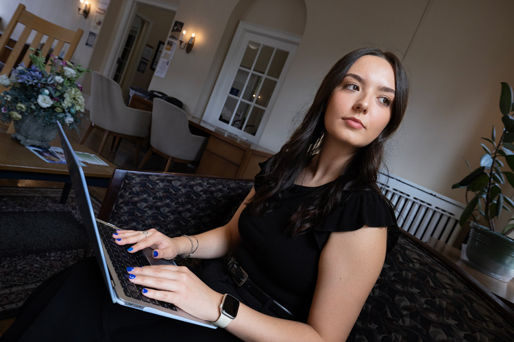 Criminal justice major Ivana Damjanic working at her laptop.
